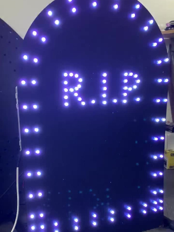 An illuminated, LED pixel tombstone used in the Halloween lights show.